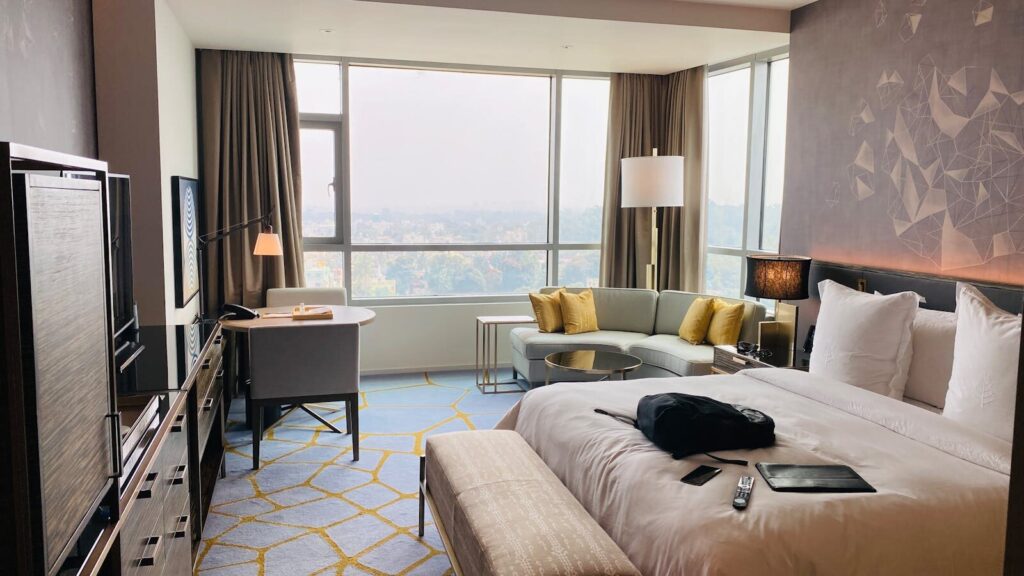 Elegant hotel suite with modern design and city view in Bengaluru.