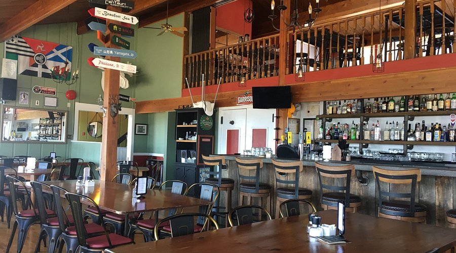 selective focus photography of burger patty, mayonnaise, and French fries served on platter