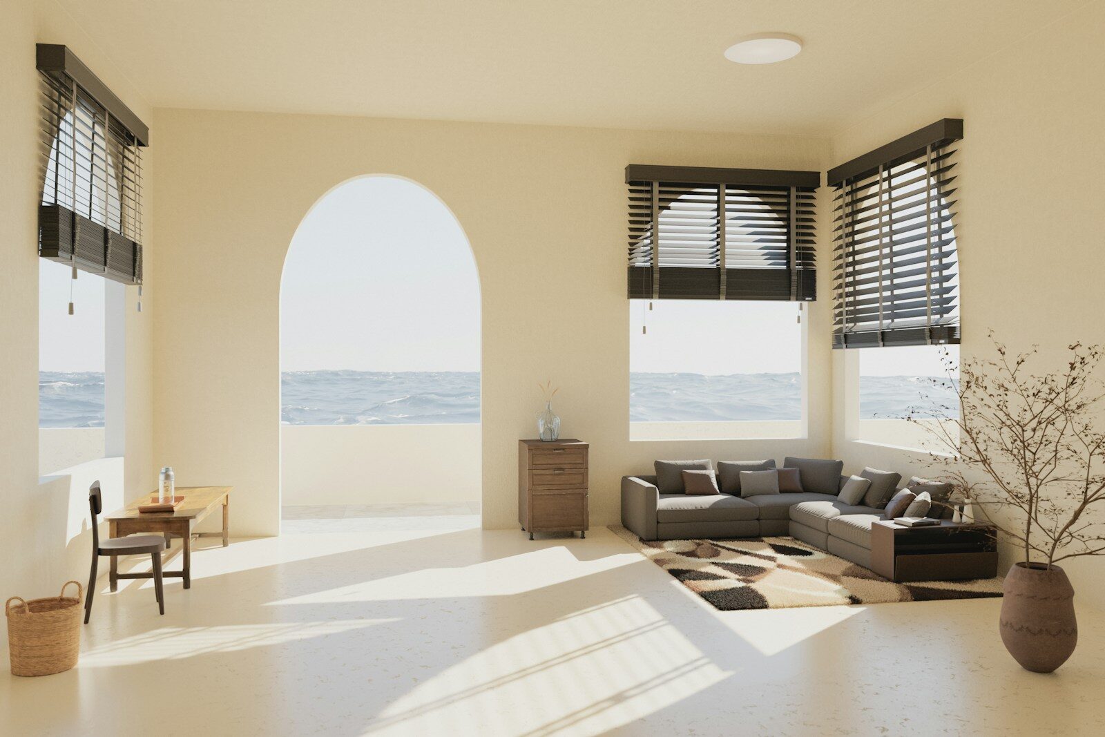 A living room filled with furniture and large windows