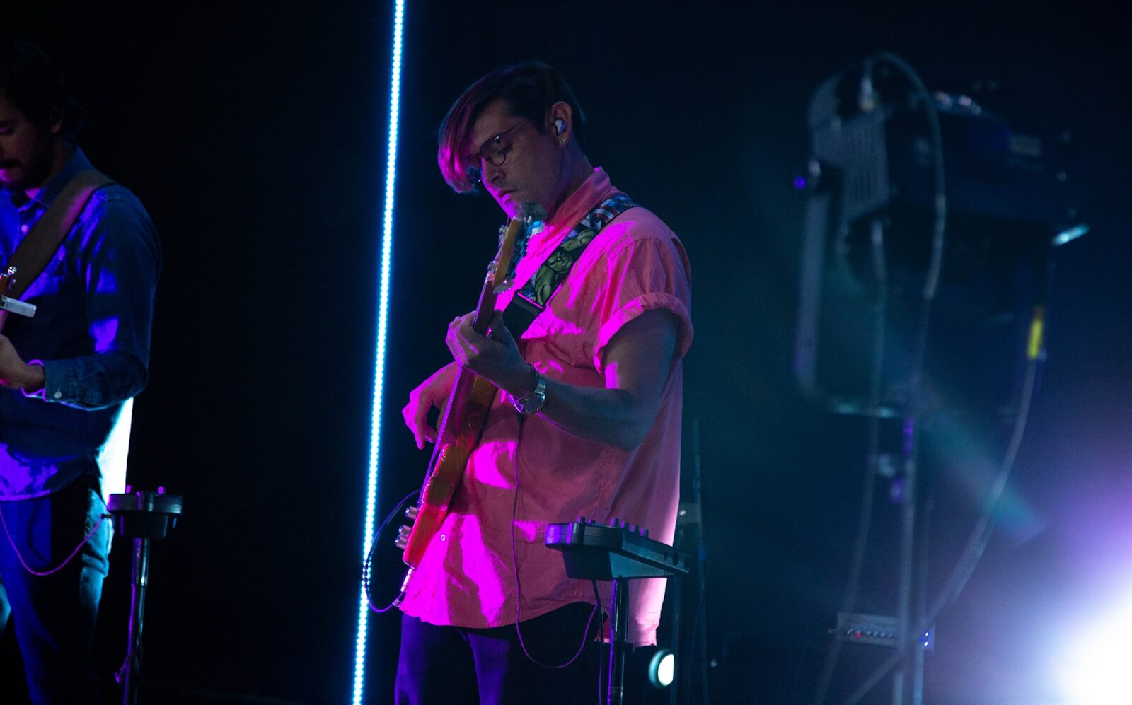 man in white t-shirt singing